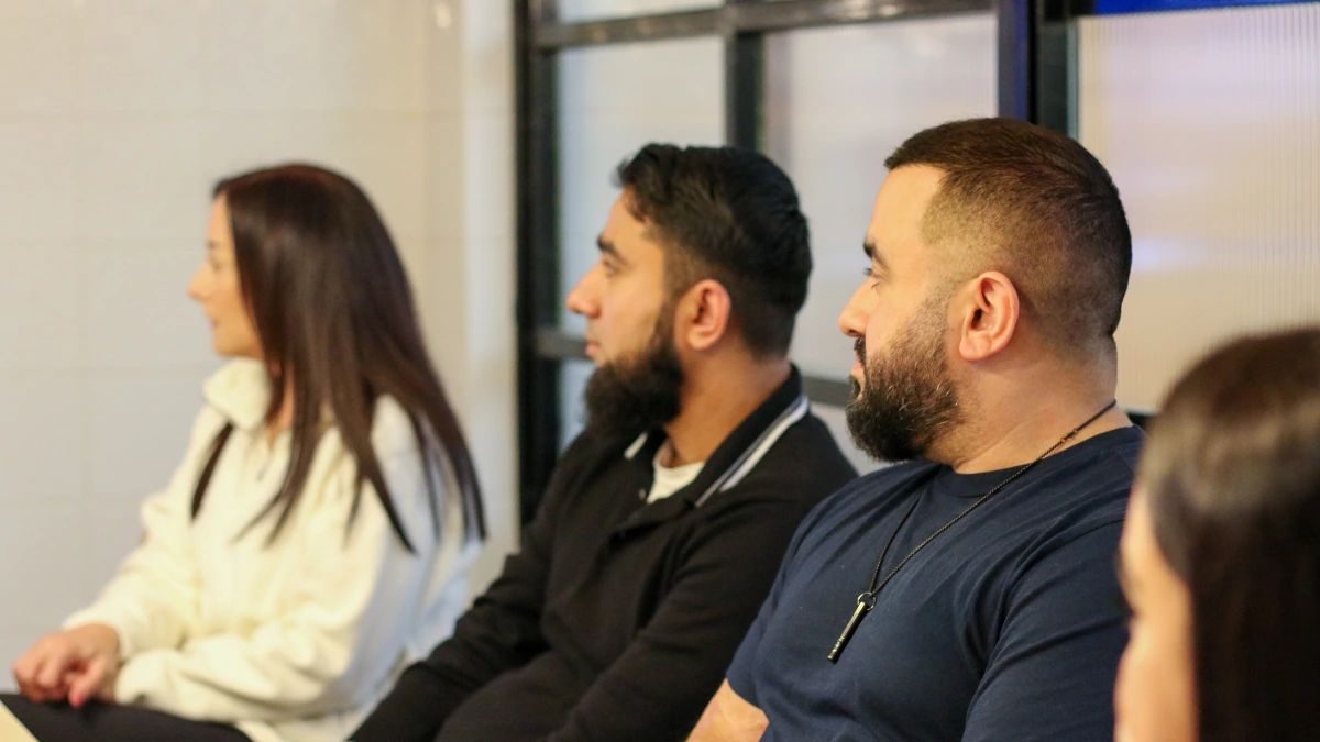 Team members listening during a meeting at IWN Accountancy